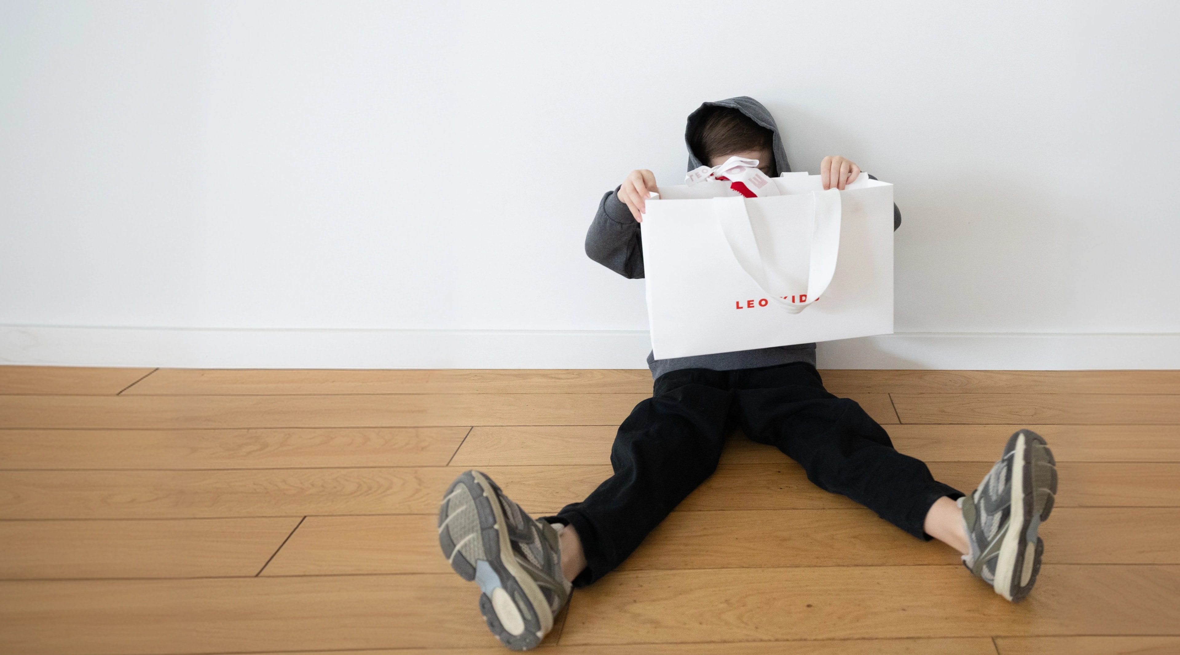 Child sitting in stylish clothing